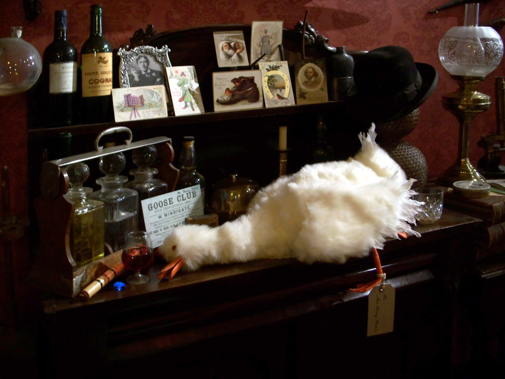 Lucy the Goose, created by Jean Upton, takes her place every Christmas in Holmes & Watson's sitting room in the famous Sherlock Holmes pub in London. ~ Photo c 2014 by Jean Upton