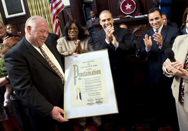 The Island's City Council members -- Debi Rose, James Oddo and Vincent Ignizio -- applaud as the City Council honors Detective Sgt. "Buddy" Murnane for his 37 years of service with the NYPD without taking a single sick day (Staten Island Advance/William Alatriste)